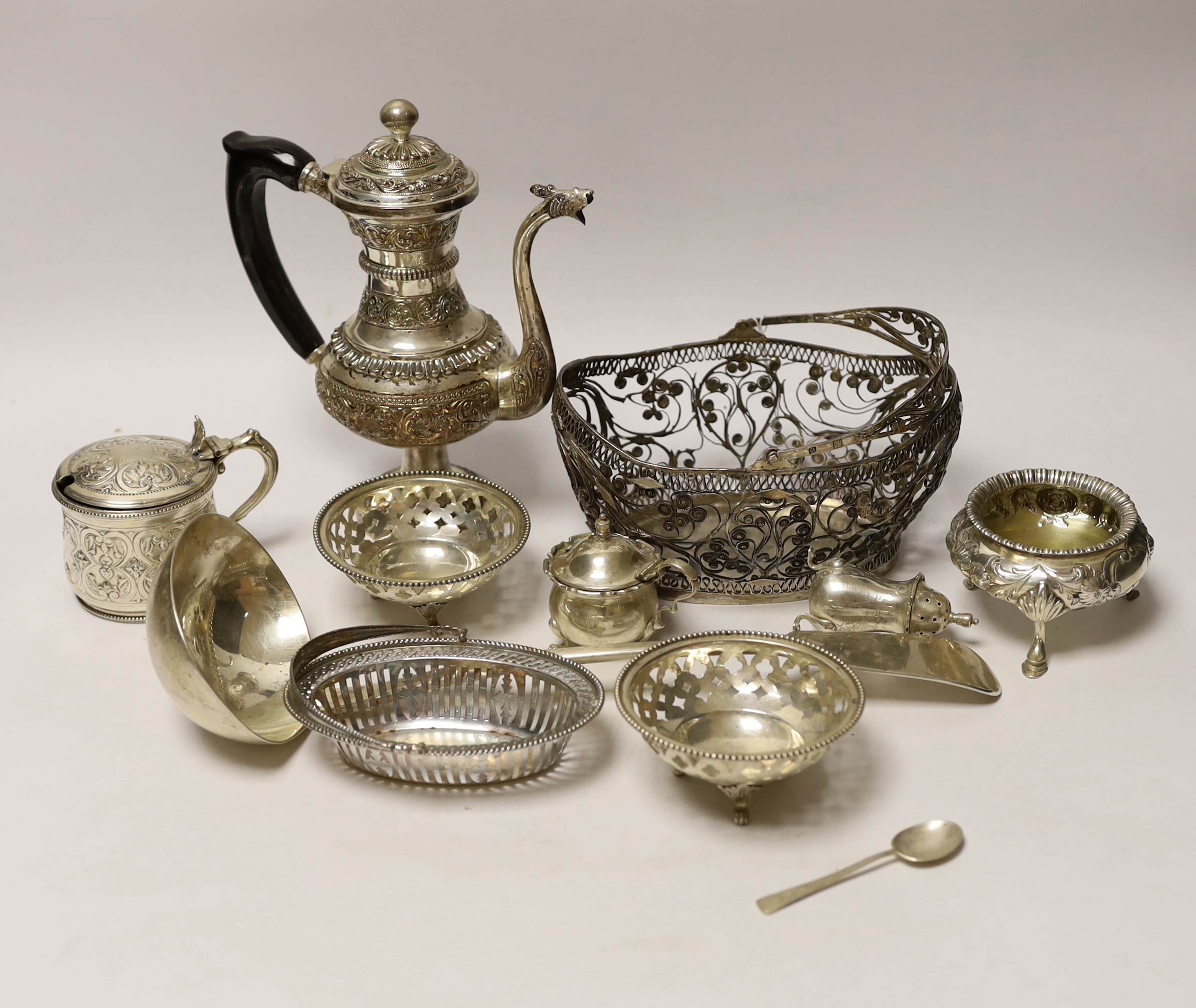 A quantity of silver and white metal items including a continental filigree basket, small silver bonbon dish, George III soup ladle, salts, Victorian silver mustard, etc.
